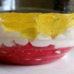 Christmas Jell-O fridge pudding (flavors: raspberry, lemon and milk)